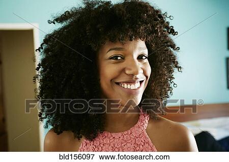 Stock Photo - Close up of smiling face of mixed race woman. Fotosearch