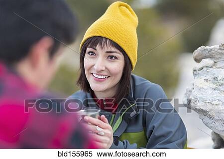 Couple drinking coffee outdoors View Large Photo Image Stock Photography - Couple drinking coffee outdoors. Fotosearch