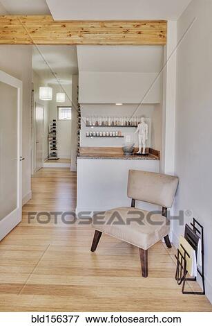 Stock Photo - Empty chair in natural healing clinic waiting room. Fotosearch