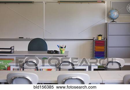 Stock Photography - Empty desks in classroom. Fotosearch