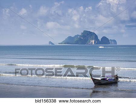 Fishing boat moored on beach View Large Photo Image Stock Photo - Fishing boat moored on beach. Fotosearch