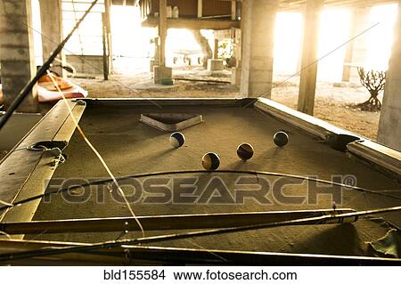 Fishing rods and pool cues on pool table View Large Photo Image Picture - Fishing rods and pool cues on pool table. Fotosearch