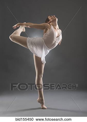 Hispanic ballet dancer posing on tip toe View Large Photo Image Stock Image - Hispanic ballet dancer posing on tip toe. Fotosearch