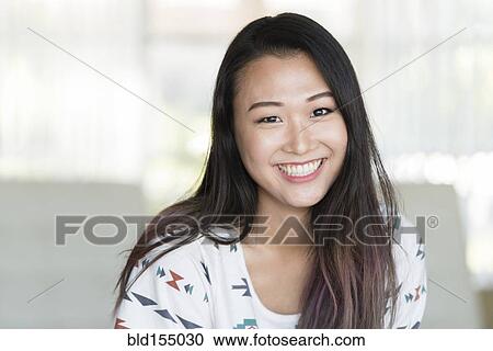 Stock Image - Korean woman smiling. Fotosearch