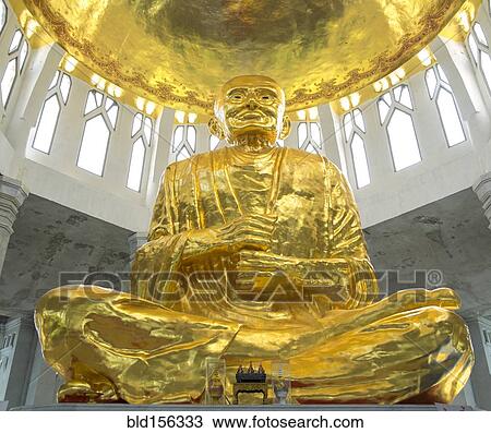 "Low angle view of golden Buddha statue in temple, Sikhiu, Nakhon Ratchasima, Thailand" View Large Photo Image Stock Image - "Low angle view of golden Buddha statue in temple, Sikhiu, Nakhon Ratchasima, Thailand". Fotosearch