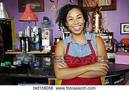 Mixed race barista smiling in coffee shop View Large Photo Image Stock Photograph - Mixed race barista smiling in coffee shop. Fotosearch