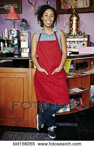 Mixed race barista smiling in coffee shop View Large Photo Image Stock Photography - Mixed race barista smiling in coffee shop. Fotosearch