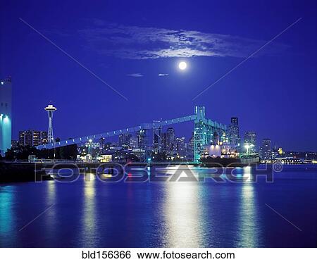 "Moon over illuminated Seattle city skyline at night, Washington, United States" View Large Photo Image Stock Photograph - "Moon over illuminated Seattle city skyline at night, Washington, United States". Fotosearch