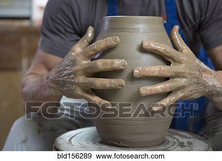 Older Caucasian man forming pottery on wheel in ceramics studio View Large Photo Image Stock Photo - Older Caucasian man forming pottery on wheel in ceramics studio. Fotosearch