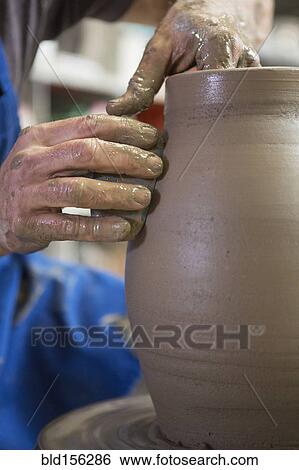 Older Caucasian man forming pottery on wheel in ceramics studio View Large Photo Image Stock Photograph - Older Caucasian man forming pottery on wheel in ceramics studio. Fotosearch