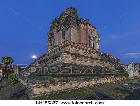 Stock Photo - "Ornate temple on hilltop under night sky, Chiang Mai, Chiang Mai, Thailand". Fotosearch