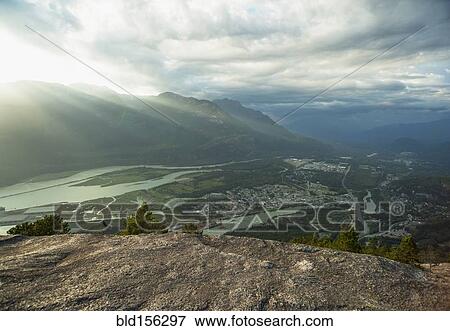 Stock Photo - "Rivers and Squamish cityscape viewed from hilltop, British Columbia, Canada". Fotosearch