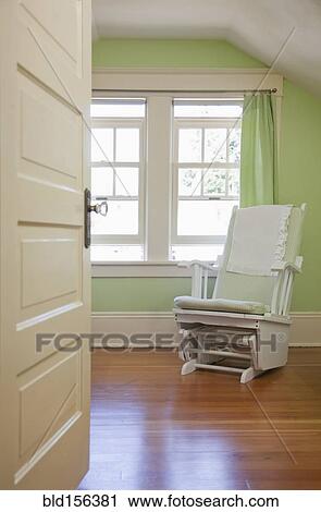 Rocking chair in nursery bedroom View Large Photo Image Stock Image - Rocking chair in nursery bedroom. Fotosearch