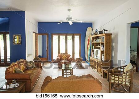 Stock Photography - "Sofas, entertainment console and doors in living room". Fotosearch