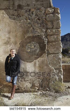 Tourist smiling near relief sculpture on wall of ruins View Large Photo Image Stock Photography - Tourist smiling near relief sculpture on wall of ruins. Fotosearch