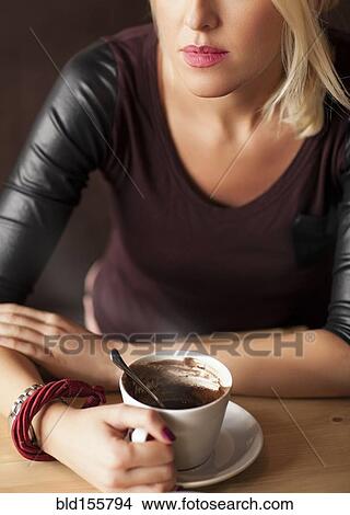 Picture - Woman drinking cup of coffee. Fotosearch