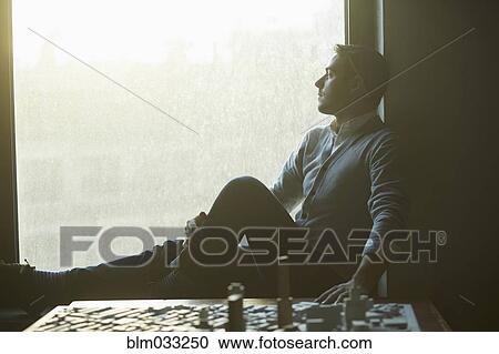 Caucasian architect at office window with urban model View Large Photo Image Stock Image - Caucasian architect at office window with urban model. Fotosearch