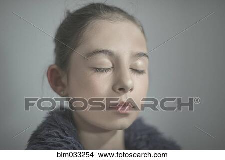 Close up of mixed race girl with eyes closed View Large Photo Image Picture - Close up of mixed race girl with eyes closed. Fotosearch