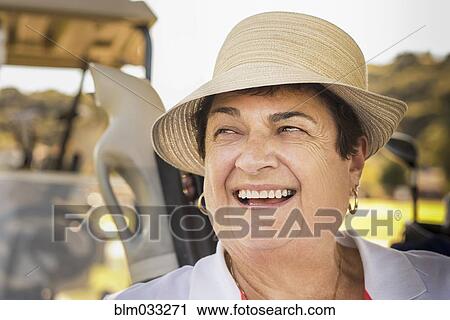 Close up of smiling older woman wearing hat View Large Photo Image Stock Image - Close up of smiling older woman wearing hat. Fotosearch