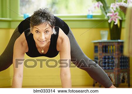 Older Caucasian woman practicing yoga View Large Photo Image Picture - Older Caucasian woman practicing yoga. Fotosearch