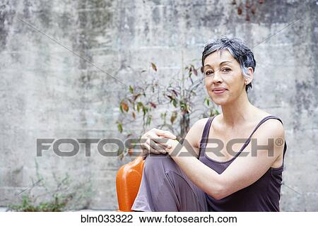 Older Caucasian woman sitting outdoors View Large Photo Image Stock Image - Older Caucasian woman sitting outdoors. Fotosearch