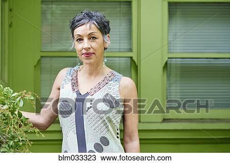 Older Caucasian woman standing outdoors View Large Photo Image Stock Image - Older Caucasian woman standing outdoors. Fotosearch