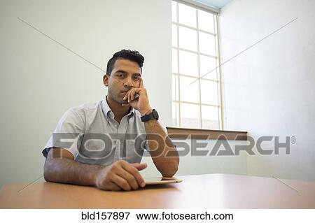 Asian businessman thinking with digital tablet in office View Large Photo Image Stock Photo - Asian businessman thinking with digital tablet in office. Fotosearch