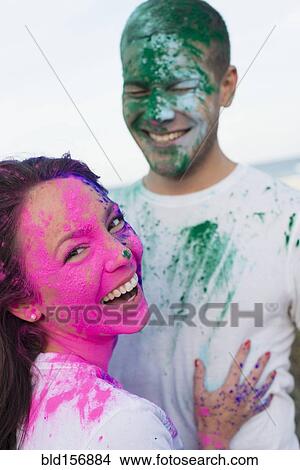 Caucasian couple splattered with paint powder View Large Photo Image Picture - Caucasian couple splattered with paint powder. Fotosearch