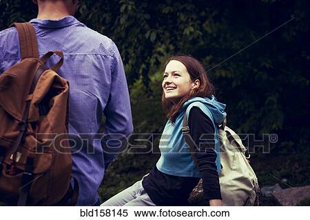 Caucasian couple with backpacks smiling outdoors View Large Photo Image Stock Photography - Caucasian couple with backpacks smiling outdoors. Fotosearch