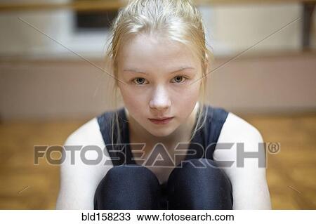 Caucasian dancer sitting on studio floor View Large Photo Image Stock Image - Caucasian dancer sitting on studio floor. Fotosearch