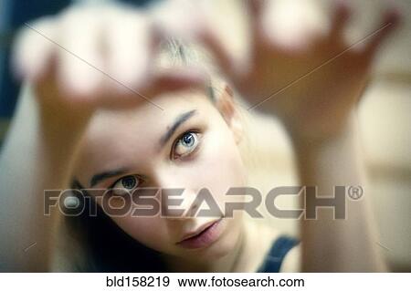Caucasian girl examining her hands View Large Photo Image Stock Photo - Caucasian girl examining her hands. Fotosearch