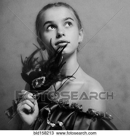 Caucasian girl holding feather mask View Large Photo Image Stock Image - Caucasian girl holding feather mask. Fotosearch
