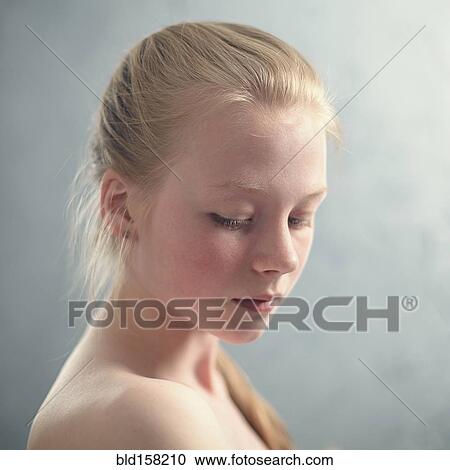 Stock Image - Caucasian girl looking down. Fotosearch