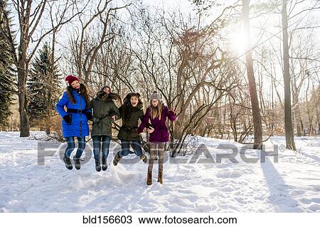 Caucasian girls playing in snowy field View Large Photo Image Stock Image - Caucasian girls playing in snowy field. Fotosearch