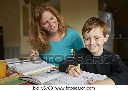 Caucasian mother helping son do homework View Large Photo Image Stock Photo - Caucasian mother helping son do homework. Fotosearch
