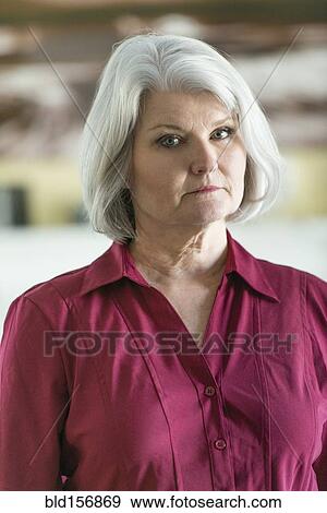 Caucasian older woman looking at camera View Large Photo Image Stock Photo - Caucasian older woman looking at camera. Fotosearch