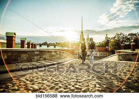 Caucasian tourists walking on cobblestone Leningrad street, Leningrad, Russia View Large Photo Image Stock Photo - Caucasian tourists walking on cobblestone Leningrad street, Leningrad, Russia. Fotosearch
