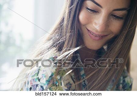 Caucasian woman looking down View Large Photo Image Picture - Caucasian woman looking down. Fotosearch