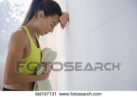 Caucasian woman resting after workout View Large Photo Image Stock Image - Caucasian woman resting after workout. Fotosearch