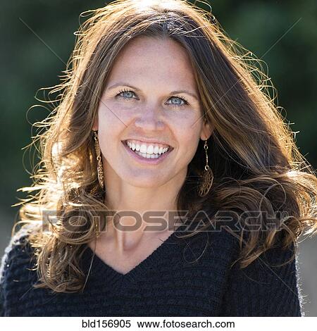 Stock Photography - Caucasian woman smiling outdoors. Fotosearch