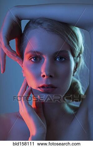 Caucasian woman touching her face View Large Photo Image Stock Image - Caucasian woman touching her face. Fotosearch