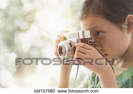 Chinese girl photographing with vintage camera View Large Photo Image Stock Image - Chinese girl photographing with vintage camera. Fotosearch