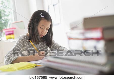 Chinese student doing homework View Large Photo Image Stock Photography - Chinese student doing homework. Fotosearch
