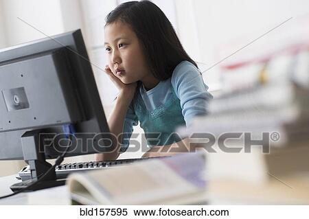 Stock Photography - Chinese student using desktop computer. Fotosearch