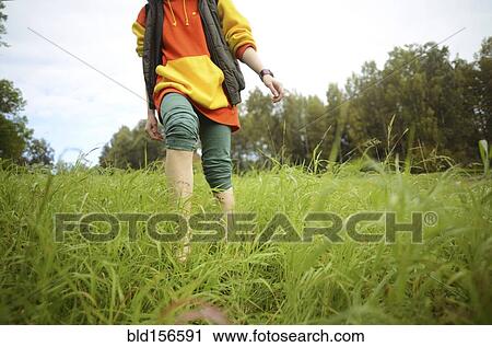 Close up of barefoot Caucasian woman walking in park View Large Photo Image Stock Image - Close up of barefoot Caucasian woman walking in park. Fotosearch