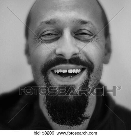 Stock Photograph - Close up of Caucasian man smiling. Fotosearch