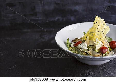 Stock Photo - Close up of cheese in salad. Fotosearch