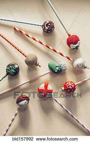 Stock Image - Close up of decorated Christmas candy lollipops. Fotosearch