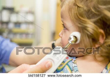 Close up of doctor taking temperature of boy with thermometer View Large Photo Image Stock Photo - Close up of doctor taking temperature of boy with thermometer. Fotosearch