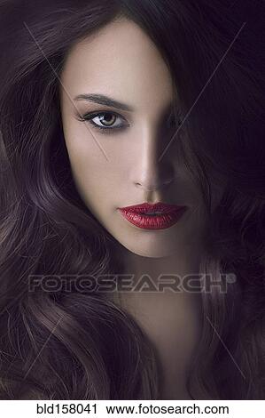Stock Image - Close up of face of glamorous woman. Fotosearch